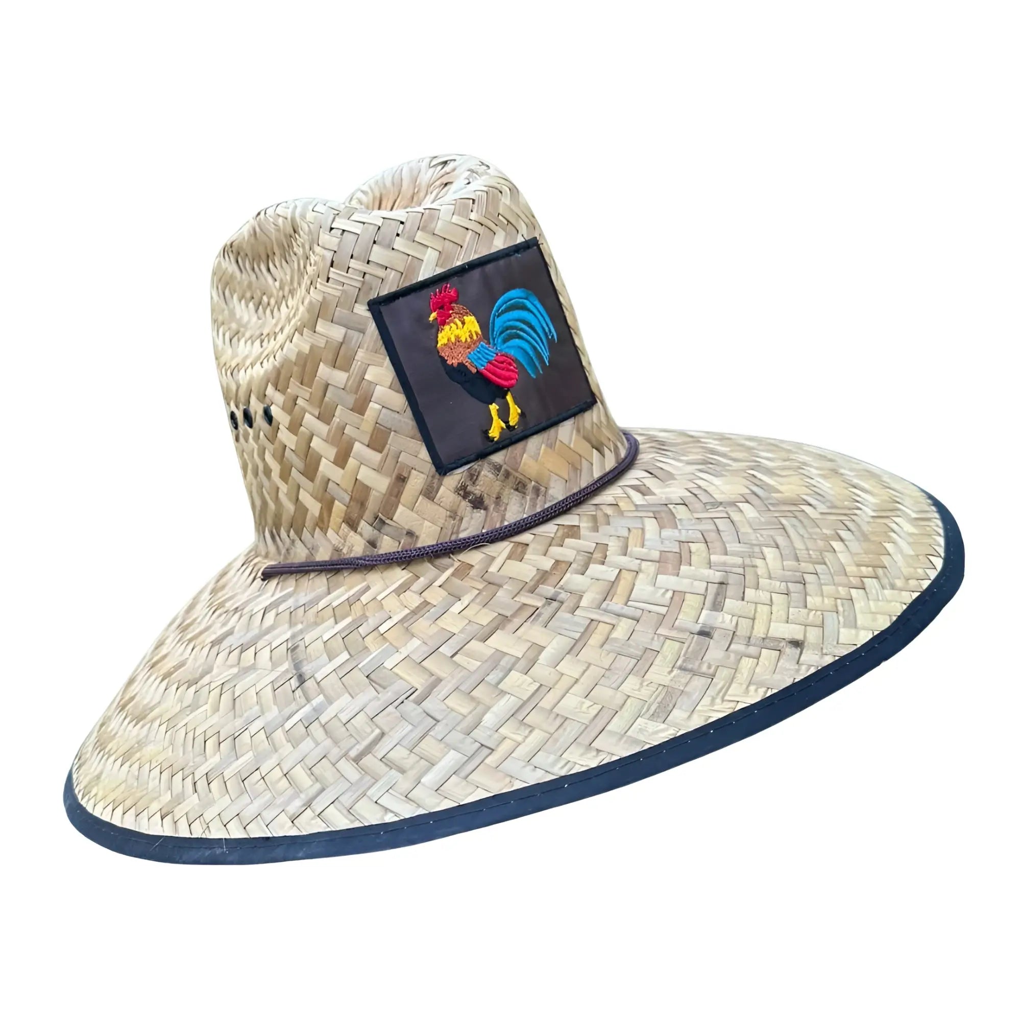 Beige woven straw lifeguard hat with wide brim navy trim and colorful embroidered rooster patch on front