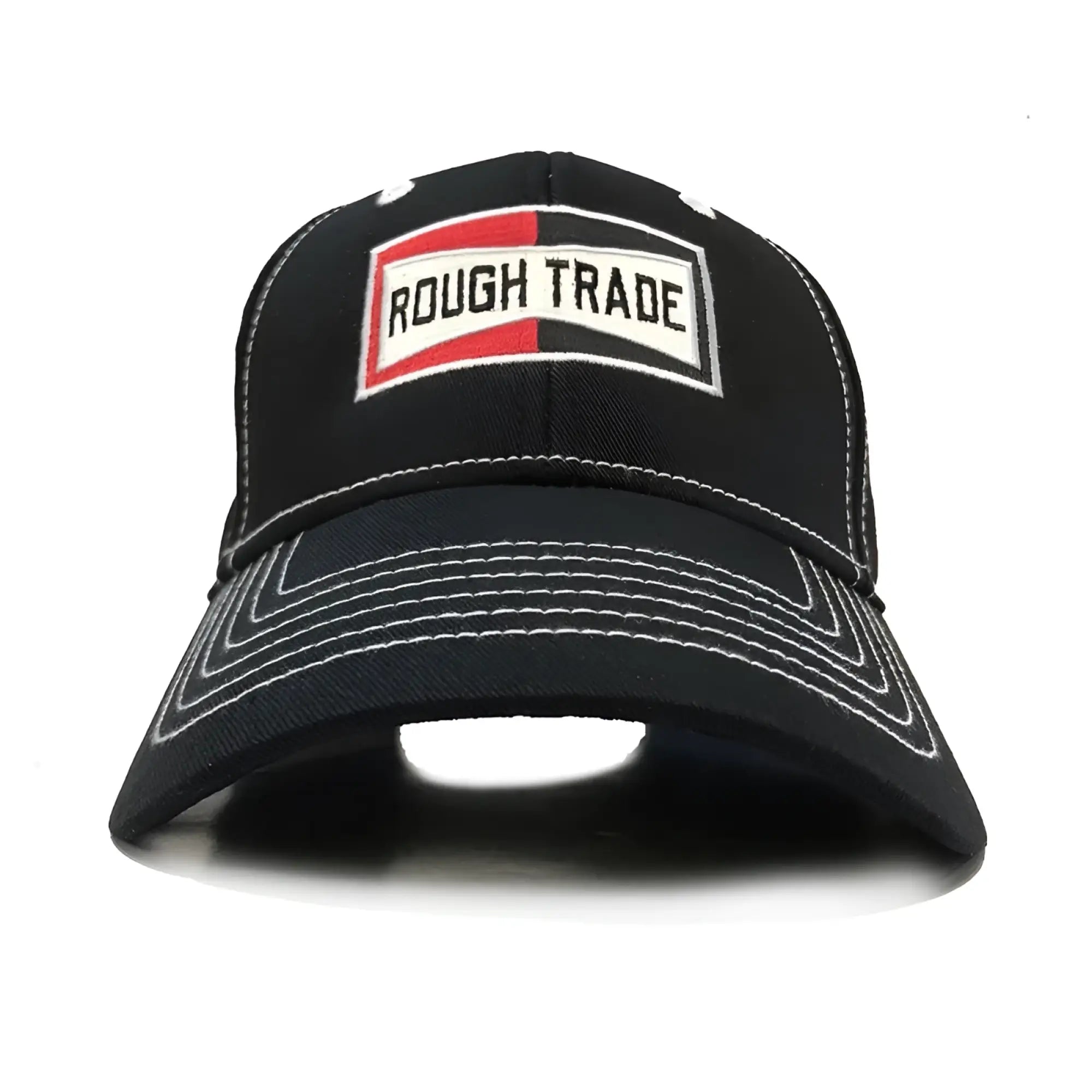 Black baseball cap with a red and white embroidered rough trade patch on the front in rough trade cap design