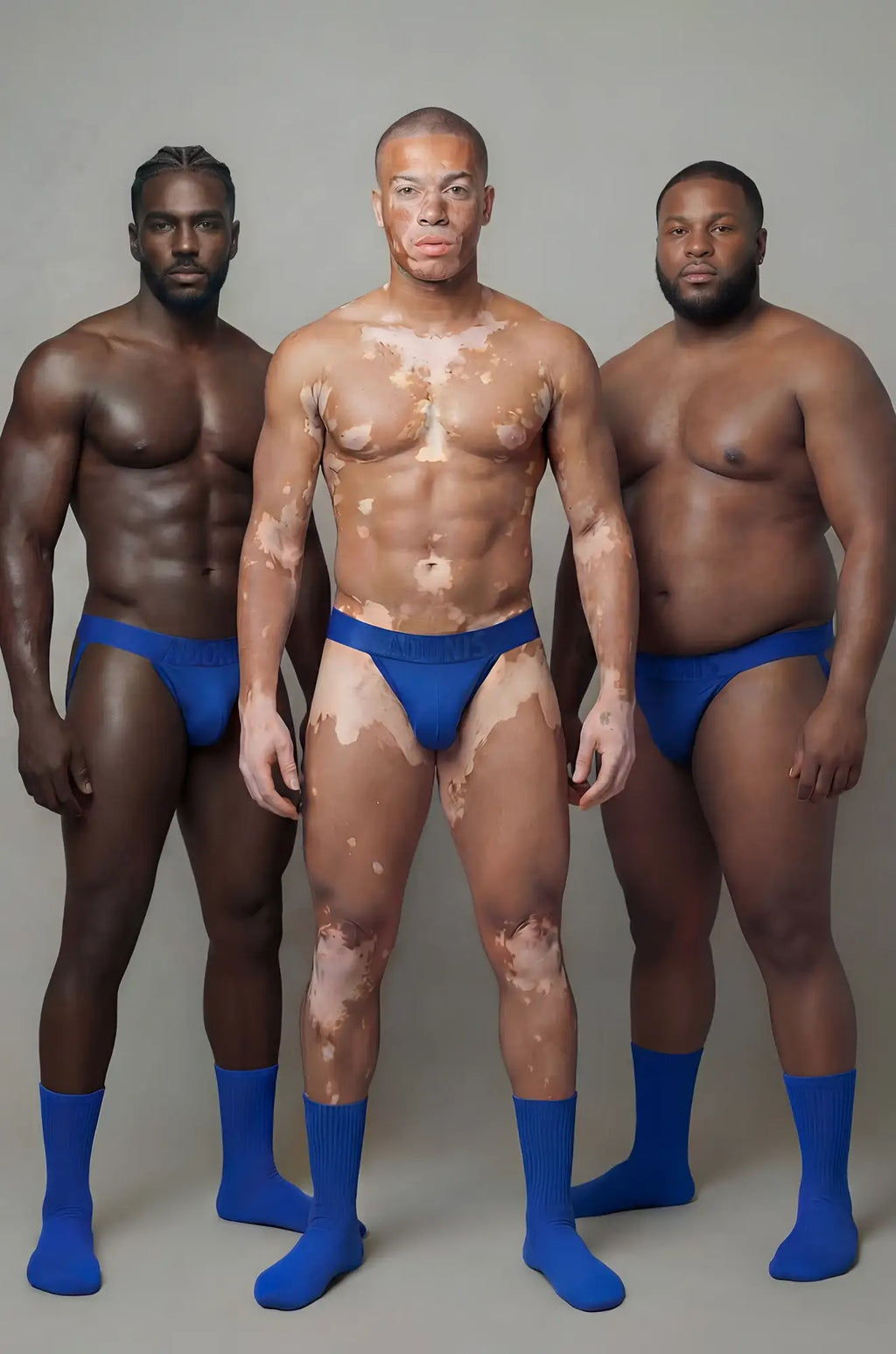 Man wearing royal blue athletic briefs with visible skin patches showing the front side of the 2-piece set