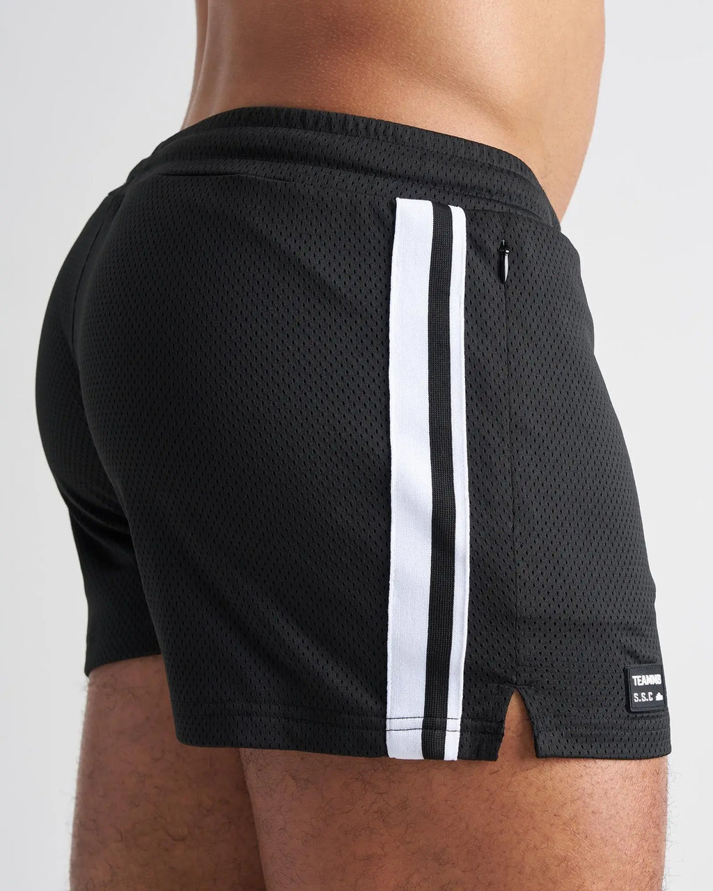Black mesh s.s.c. fraternity 3 inch athletic shorts with two white stripes and a small brand tag on the lower right leg