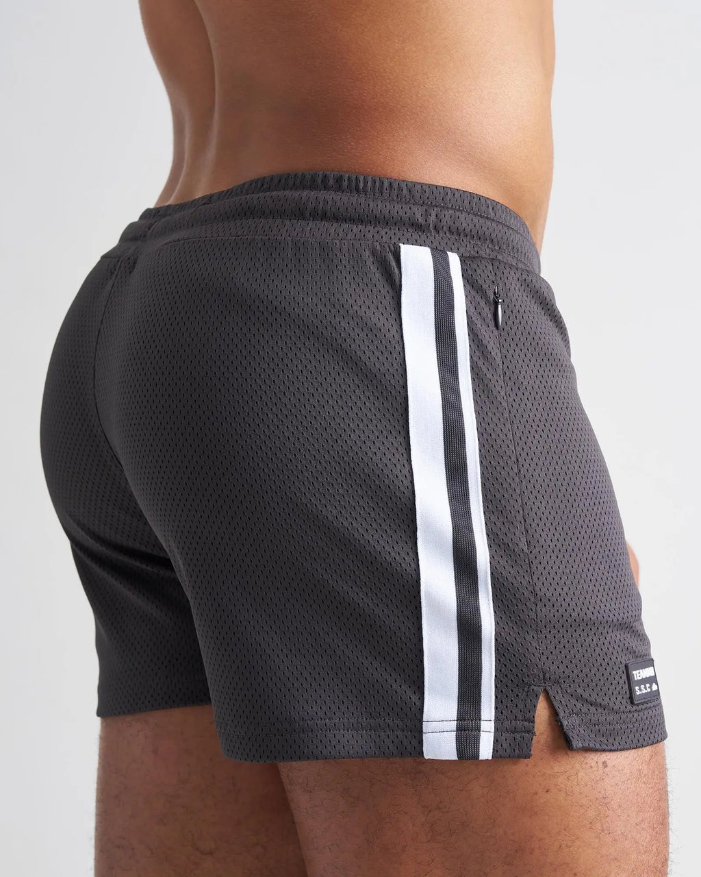 Dark gray mesh s.s.c. fraternity 3 inch athletic shorts with two white vertical stripes and black brand tag at hem