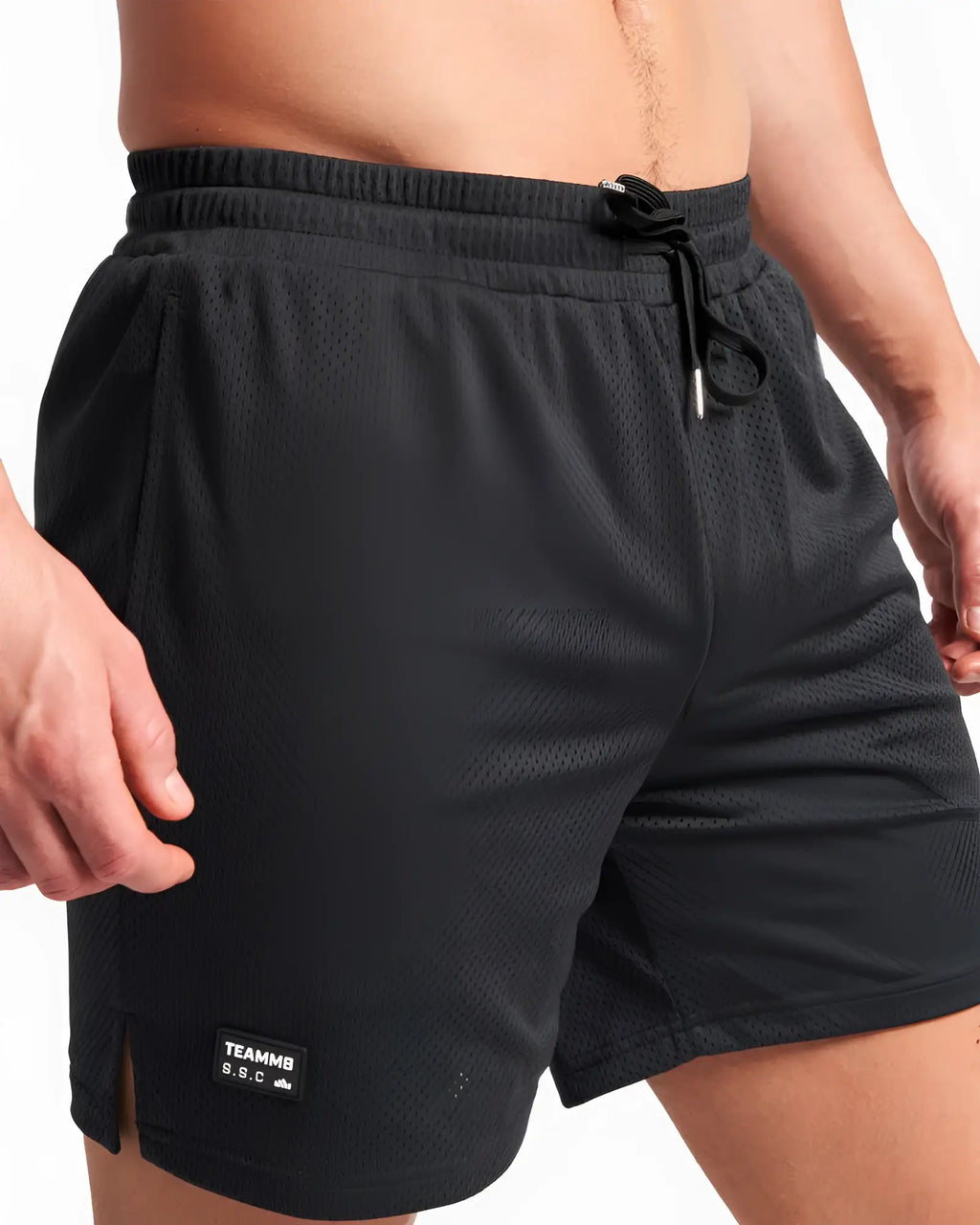 Black mesh s.s.c. mesh 6 inch shorts with drawstring waistband and small brand patch on lower left leg