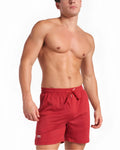 Red mesh s.s.c. mesh 6 inch athletic shorts with drawstring waistband and small brand tag on lower left leg