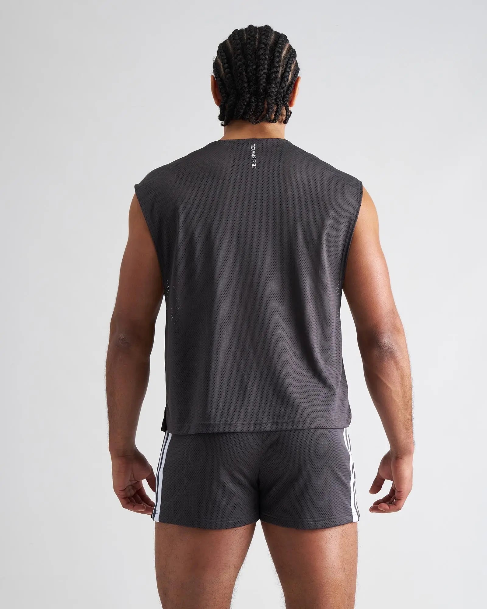 Dark gray mesh sleeveless s.s.c. muscle tank showing back side with a subtle vertical logo for athletic use