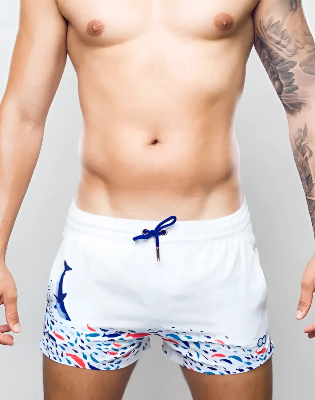 White swim trunks s50 seascape print with blue whale graphic colorful fish pattern and navy drawstrings
