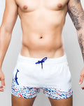 White swim trunks s50 seascape print with blue whale graphic colorful fish pattern and navy drawstrings
