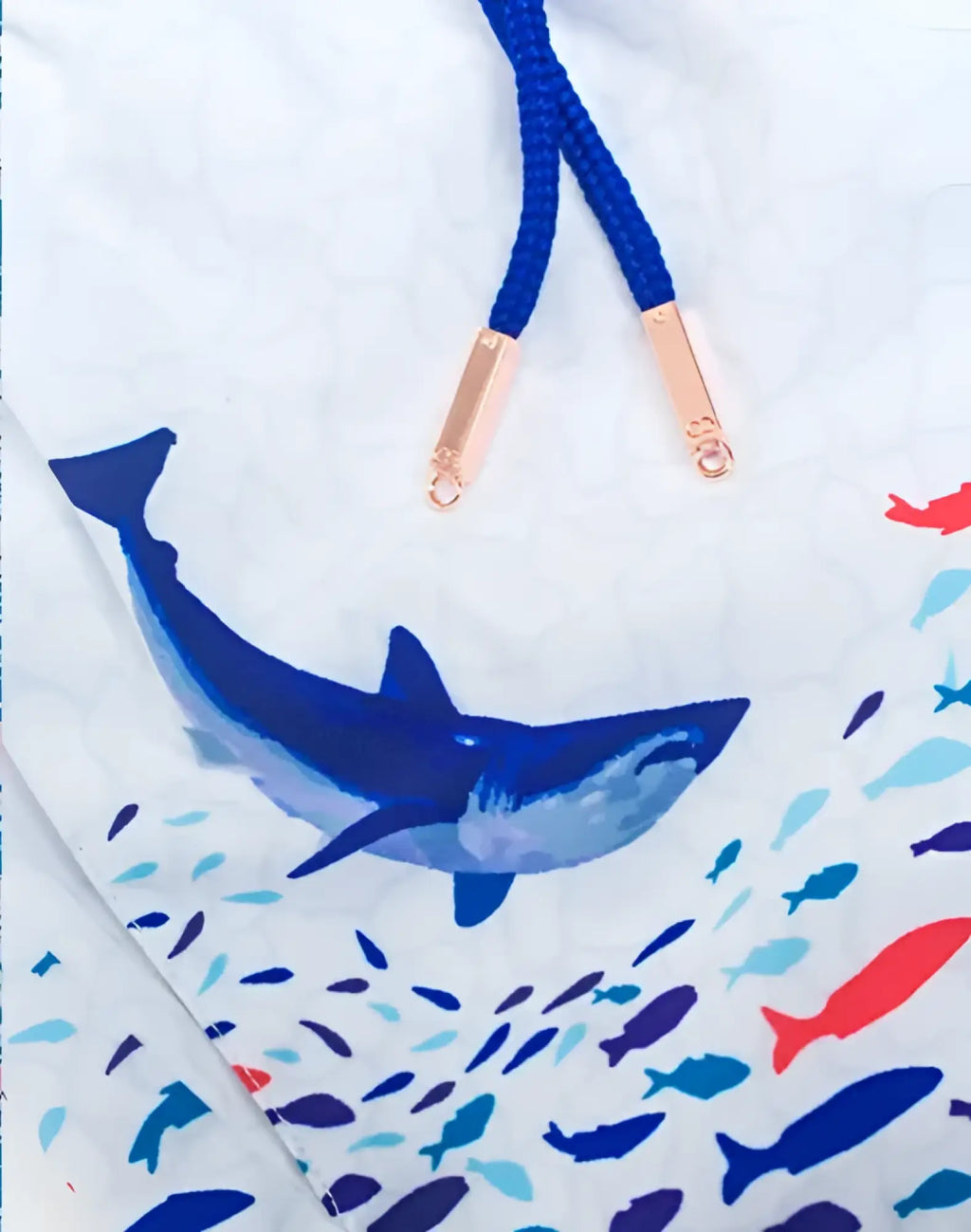 White swim trunks s50 seascape print featuring bold blue shark colorful fish with navy drawstrings and rose gold tips