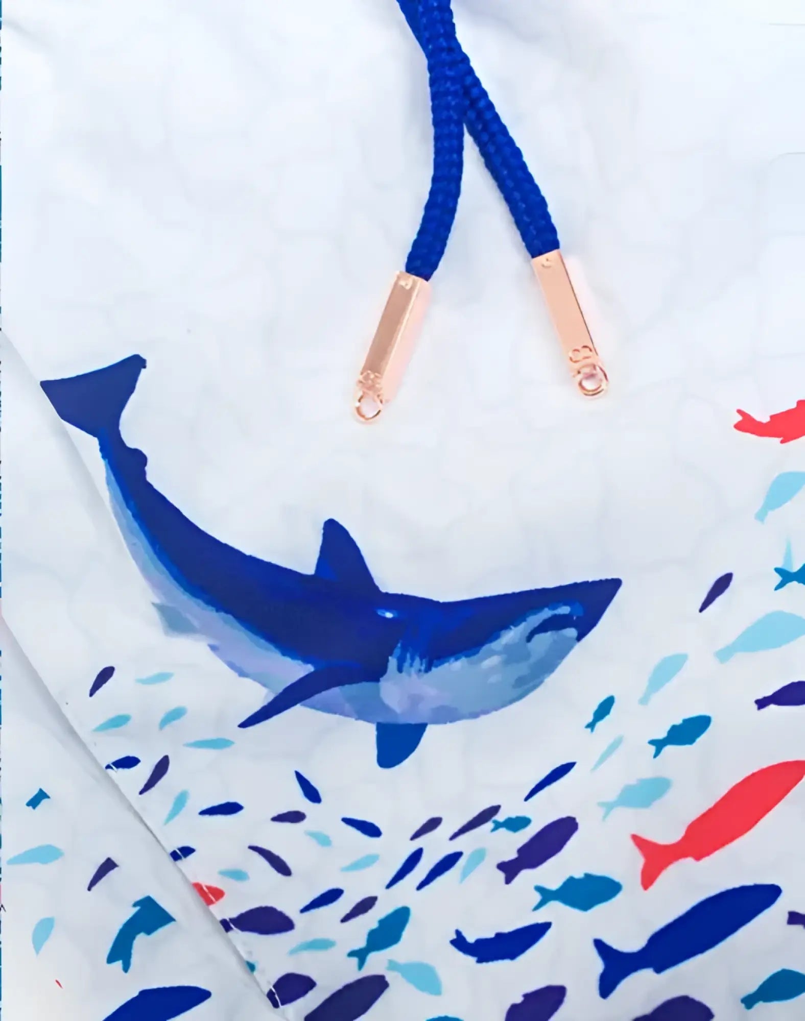 White swim trunks s50 seascape print featuring bold blue shark colorful fish with navy drawstrings and rose gold tips