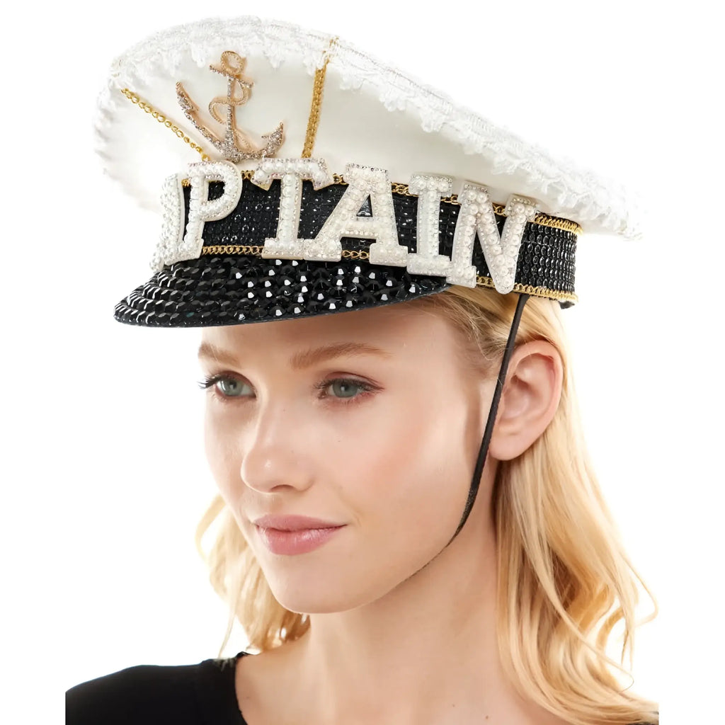 Sailor captain hat with sparkling white and black design, gold anchor, rhinestone captain lettering, and sequined details