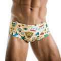 Beige men’s designer swim trunks featuring vibrant tattoo-style print with skulls dice eye and tiger for swimwear clearance