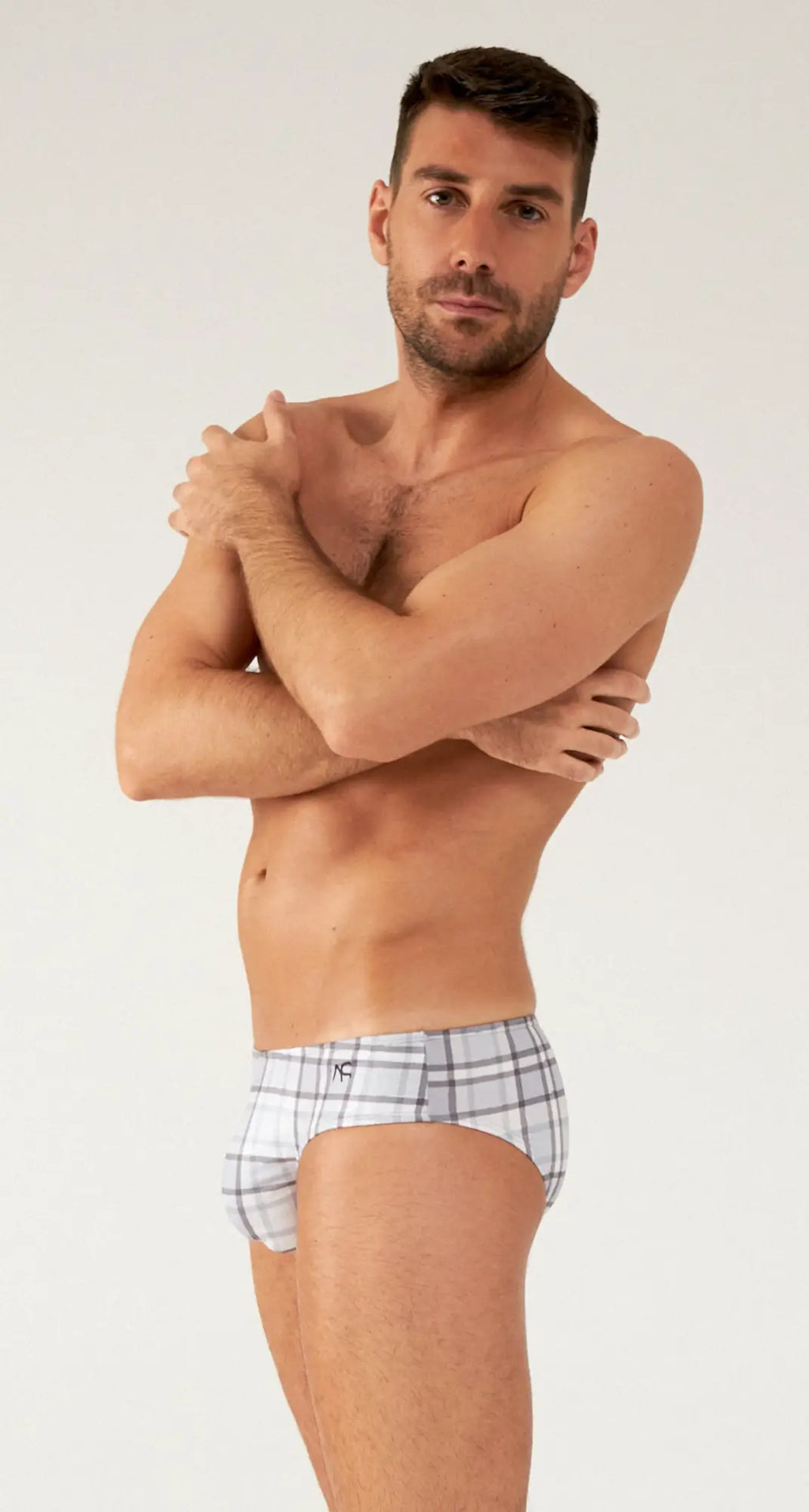 Saltire bikini plaid-patterned men’s briefs in white and gray with a comfortable fit and breathable fabric