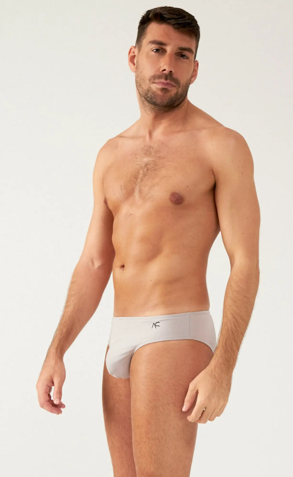 White saltire bikini briefs with a small black logo on the waistband made from soft breathable fabric