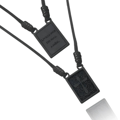 Black rectangular scapular cord men’s necklace with textured surface and engraved deliver us from evil amen inscription
