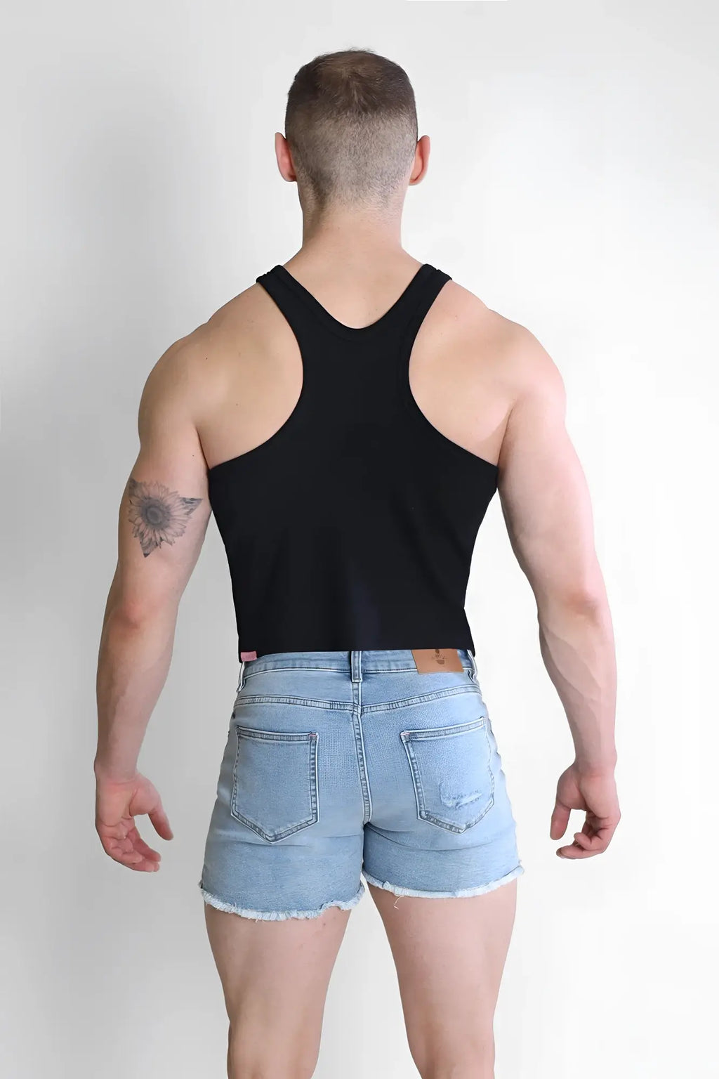 Black scooped racer v tank top showing the back side with racerback design and lightweight fabric