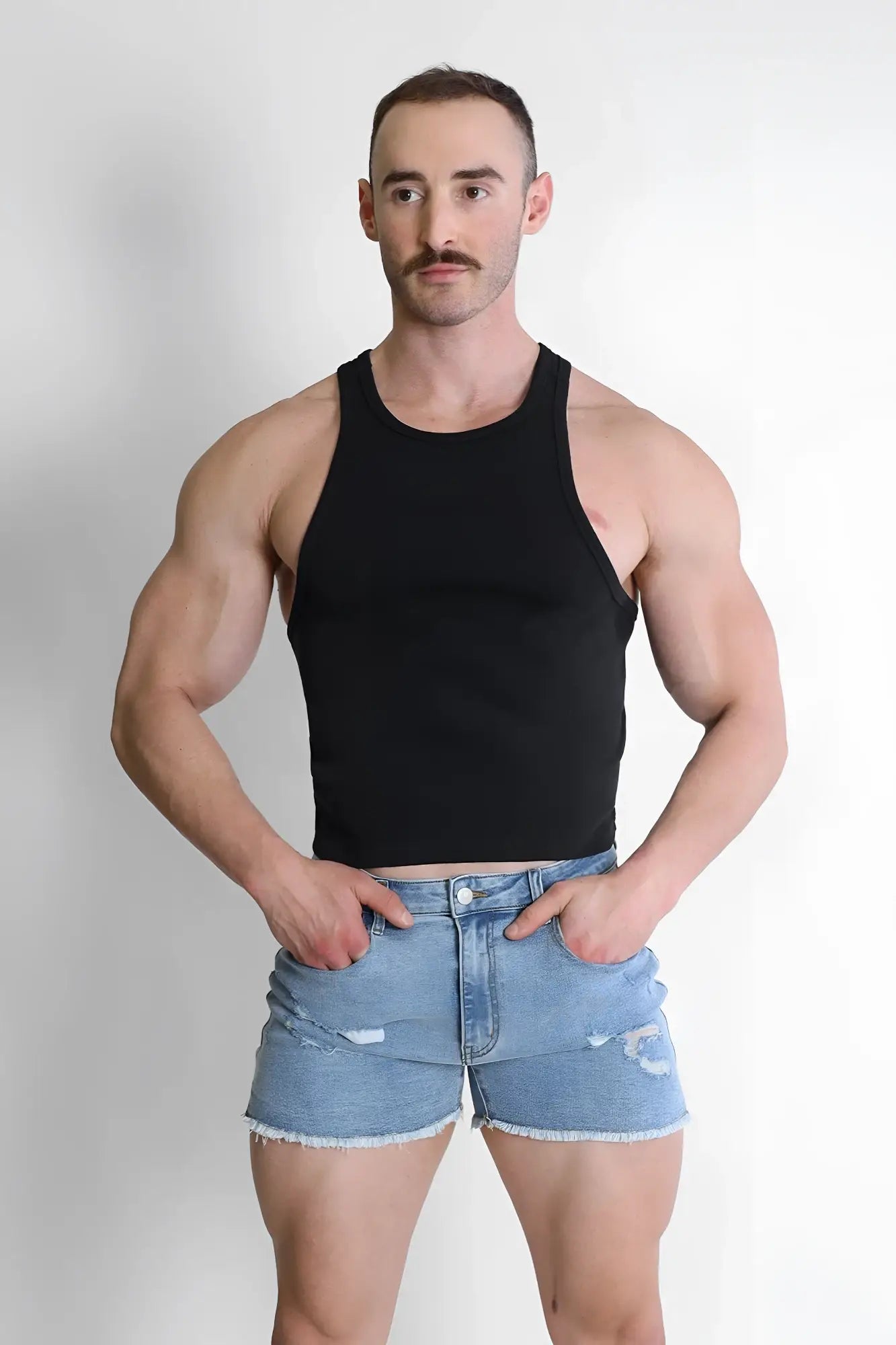 Black sleeveless scooped racer v tank top with fitted crop design ideal for casual or active wear