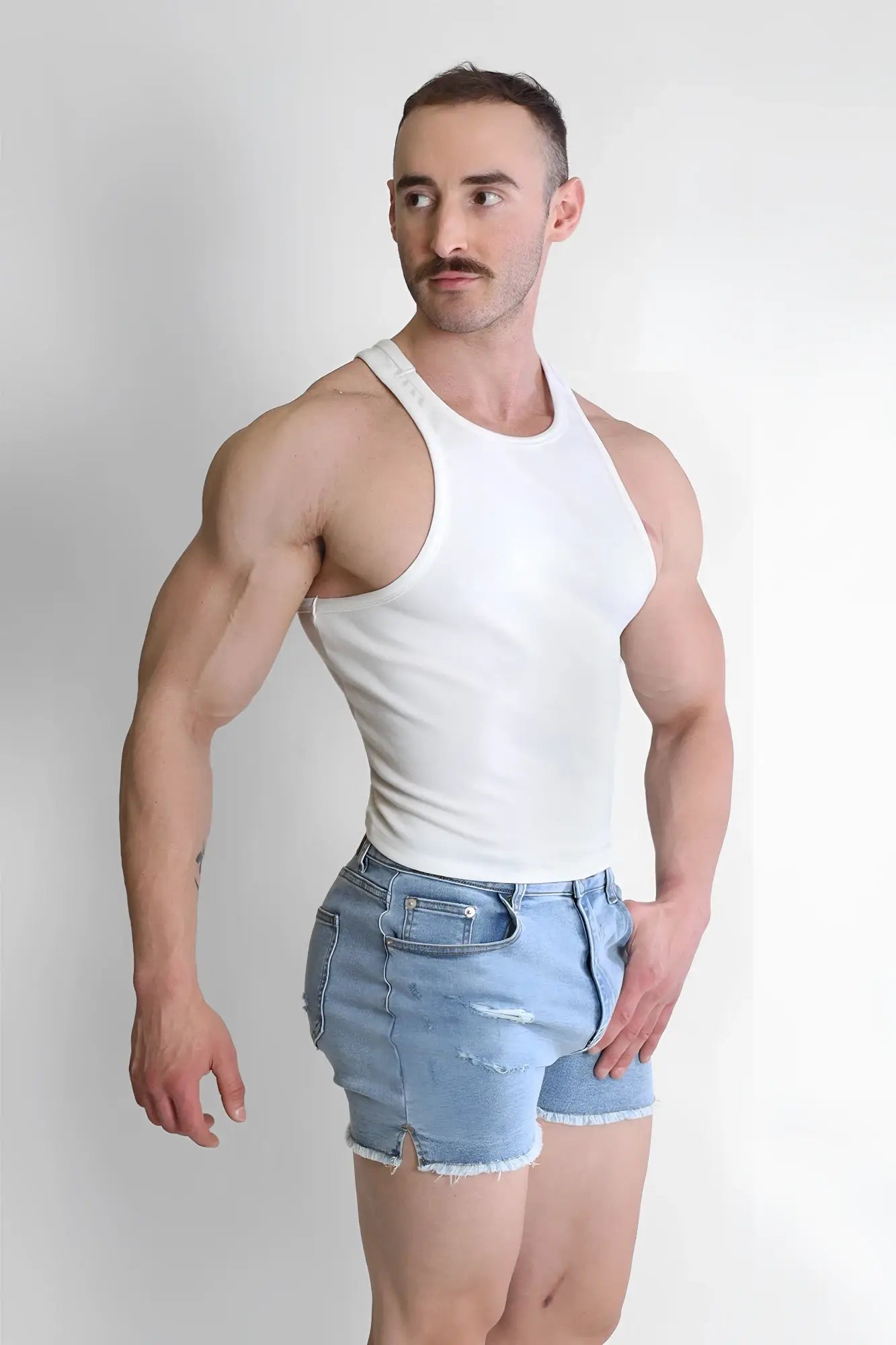 White sleeveless scooped racer v tank top made of breathable fabric perfect for casual and athletic wear