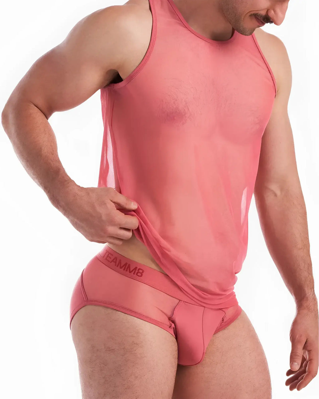 A coral-colored sheer score sheer tank top with a fitted, form-fitting design perfect for layering or warm weather