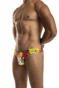 Vibrant floral-patterned second skin swimsuit men’s swim trunks in red yellow and green on white base