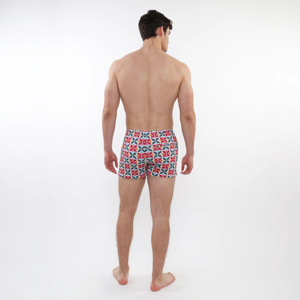 Men’s seersucker swim shorts with bold red navy blue and white geometric pattern and mesh lining