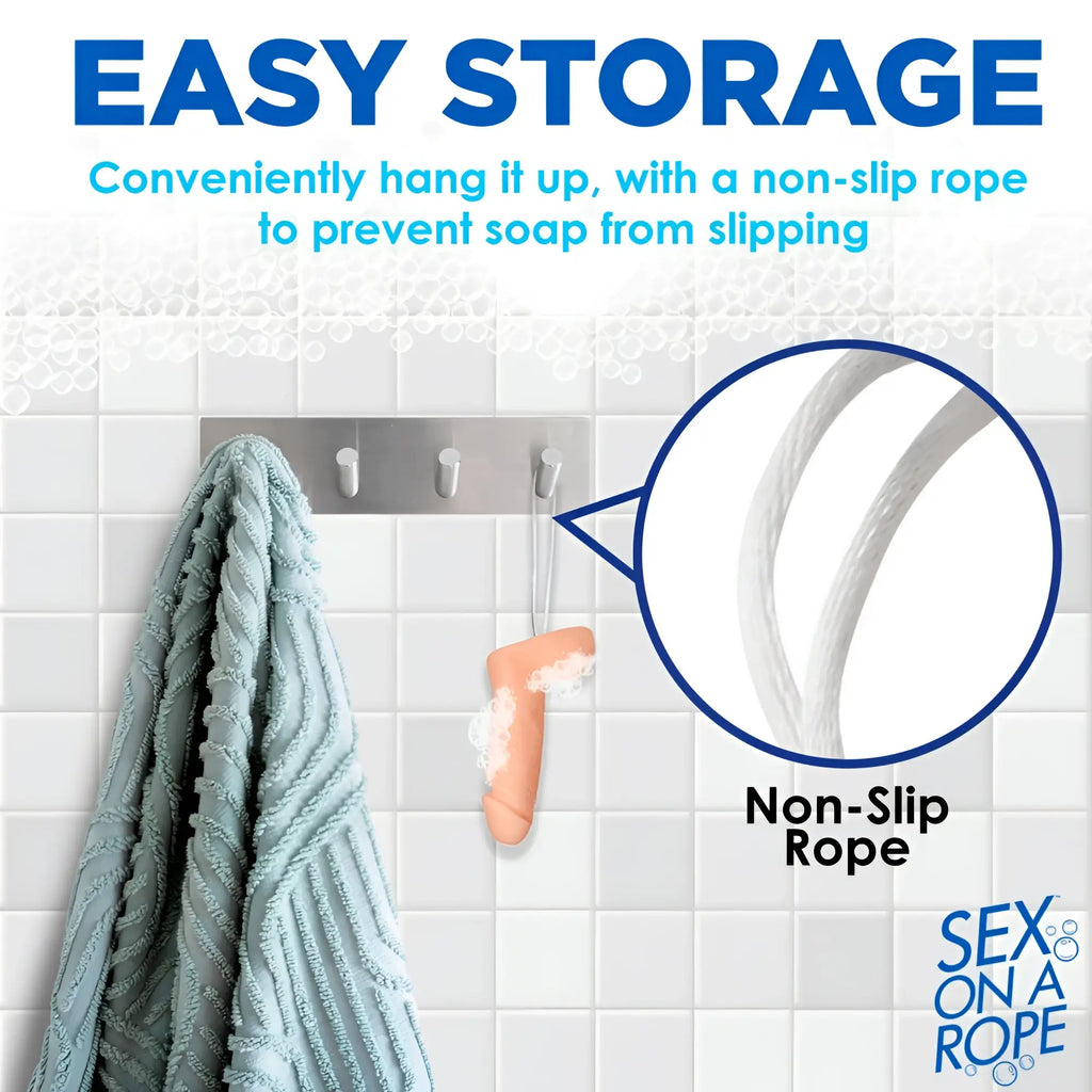 Sex on a Rope Pecker Soap, a light peach, phallic-shaped soap hanging from a wall hook by a white non-slip rope.