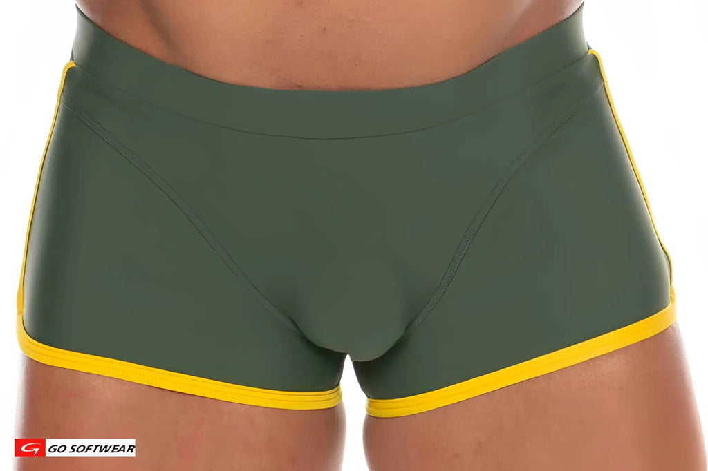 Dark green seychelles sq-cut swim trunks with bright yellow trim along waistband and leg openings