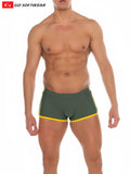 Dark green Seychelles sq-cut swim trunks with bright yellow trim perfect for swimwear and beachwear