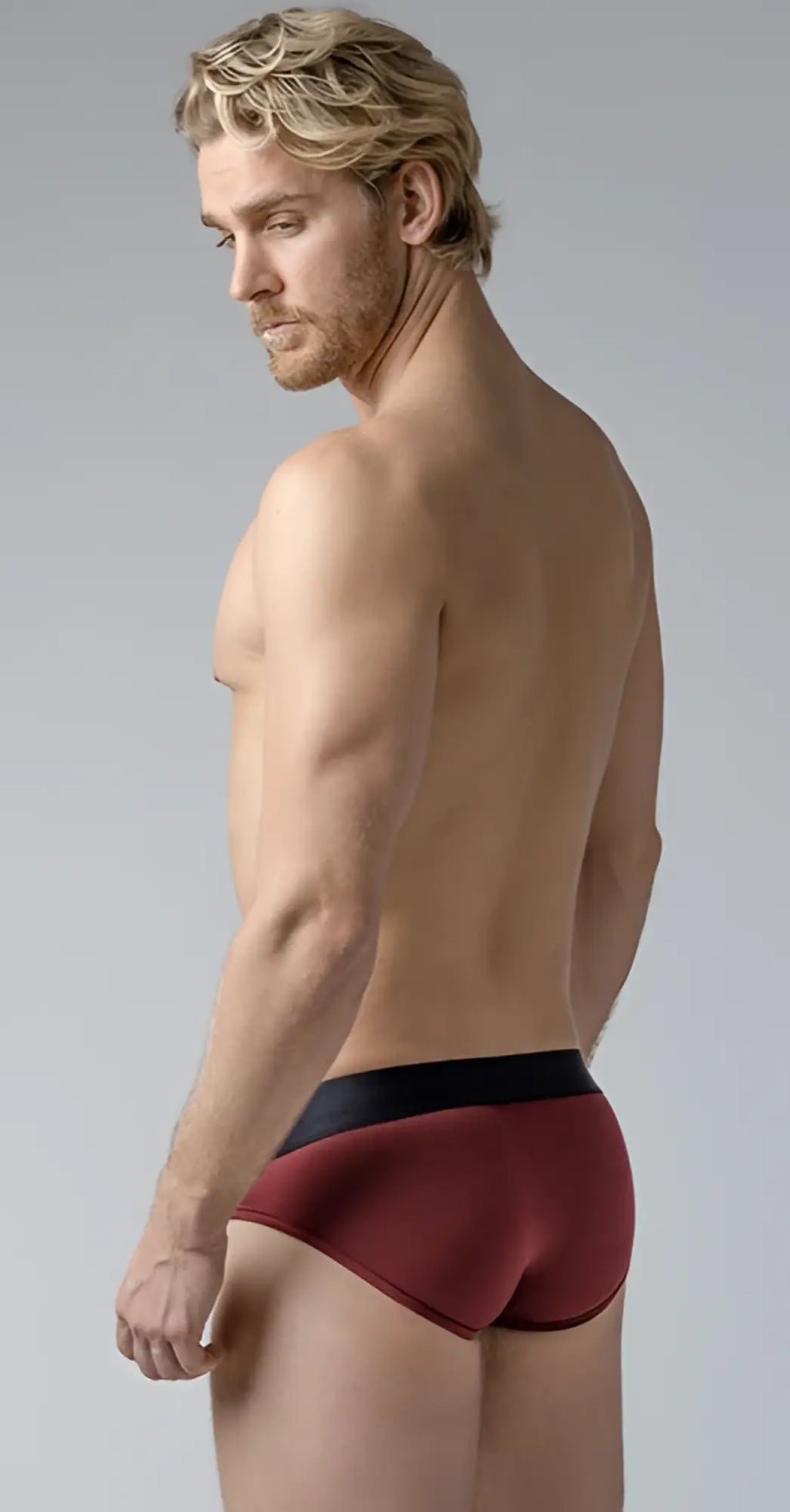 Red and black shaped pouch briefs with a sleek modern design offering comfort and support in breathable fabric