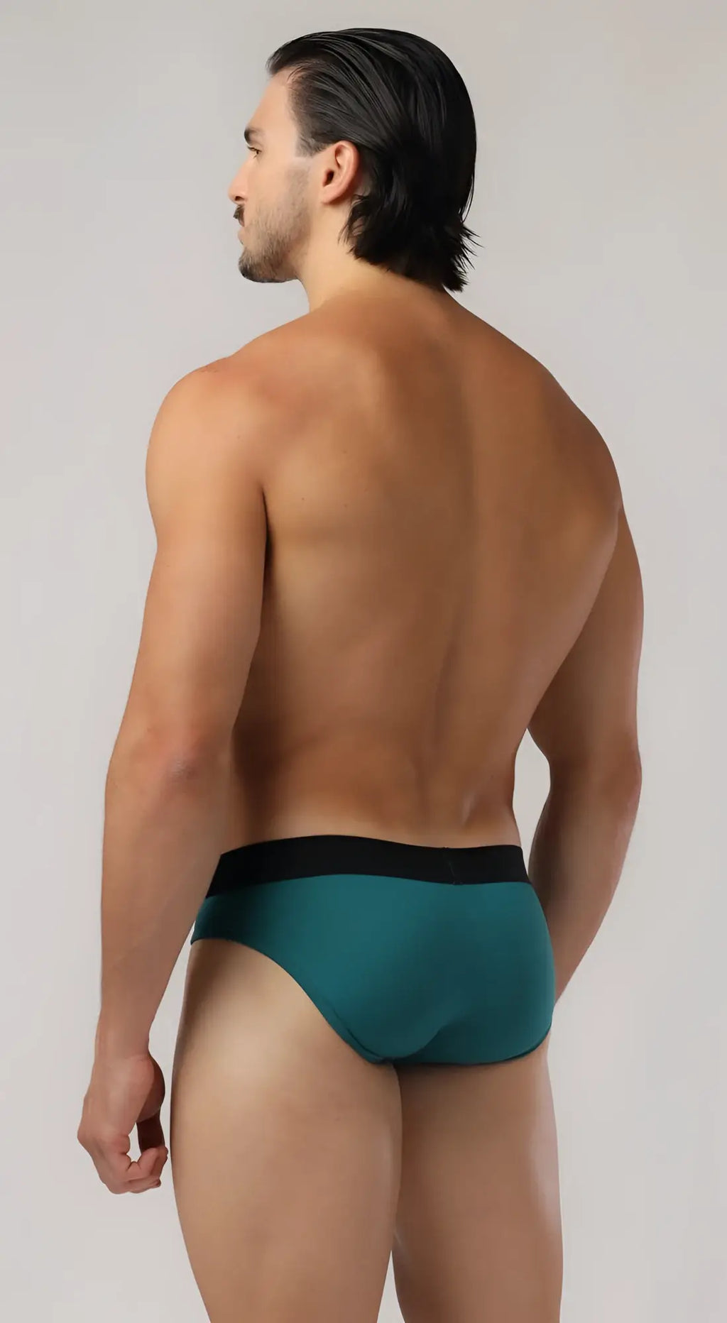 Teal shaped pouch briefs with black waistband designed for comfort and support in lightweight breathable fabric