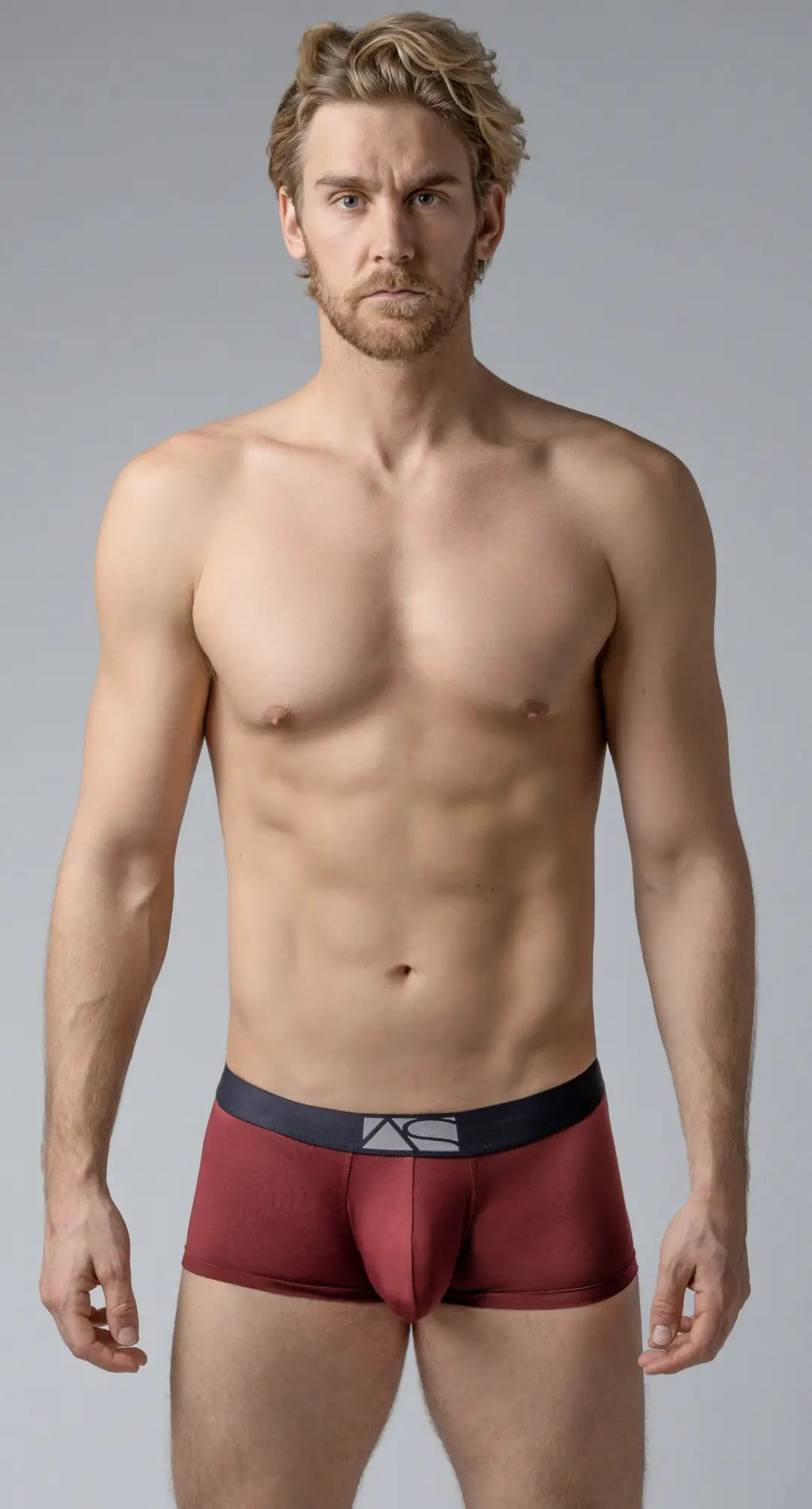 Maroon shaped pouch trunks boxer briefs with black waistband and white logo for comfortable support