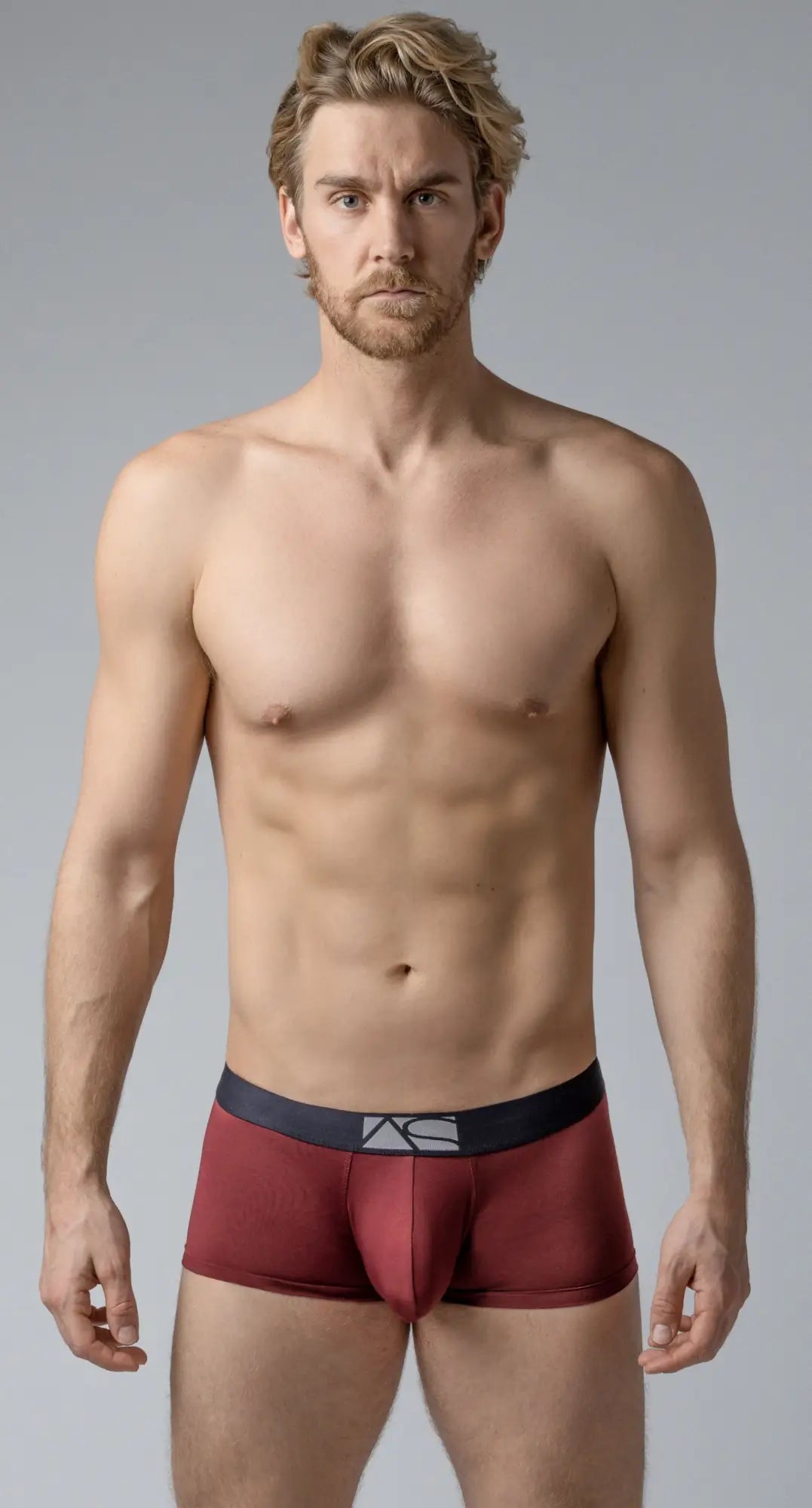 Maroon shaped pouch trunks boxer briefs with black waistband and white logo for comfortable support