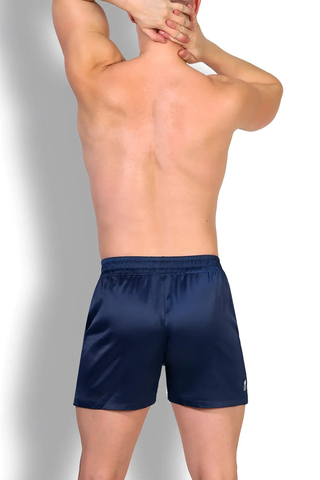 Navy blue satin shimmerflex active shorts with subtle logo on lower right leg for comfortable workouts