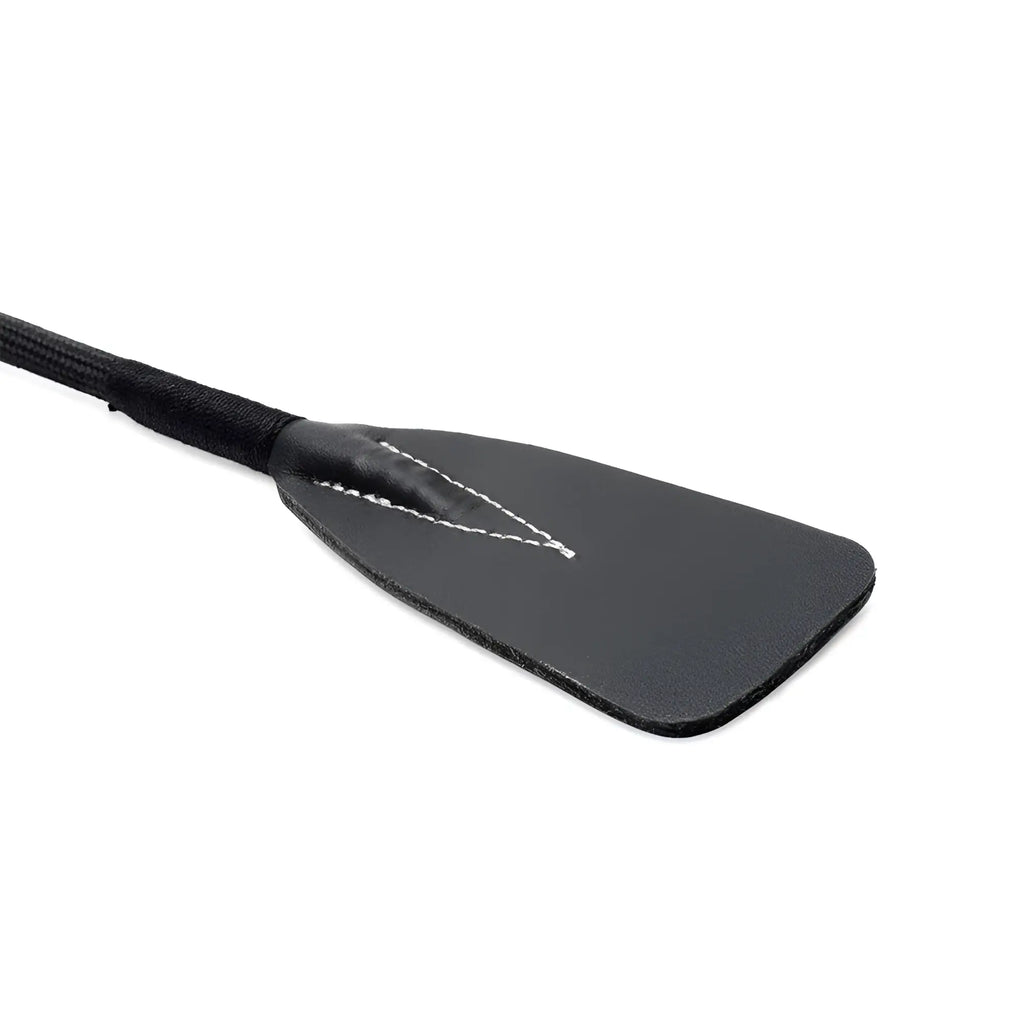 Black leather short riding crop with rhinestone handle and white stitching along the edge