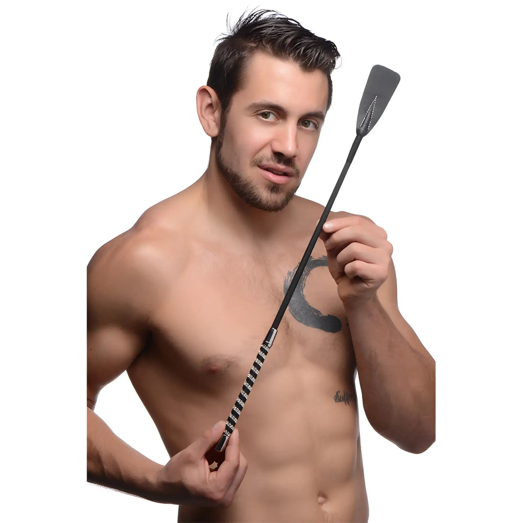 Short black leather riding crop with rhinestone handle silver accents and textured grip for equestrian use