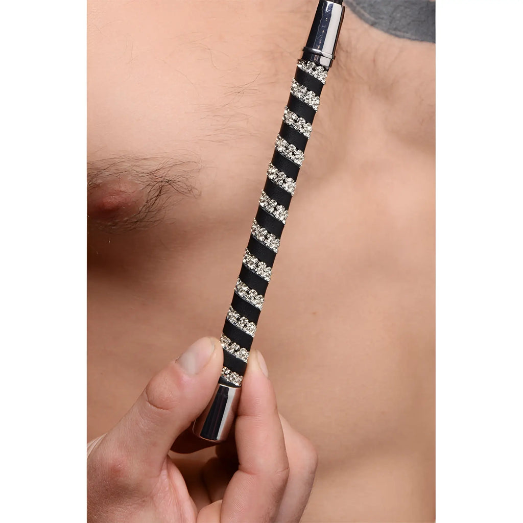 Short leather riding crop with black and silver stripes and rhinestone embellished handle
