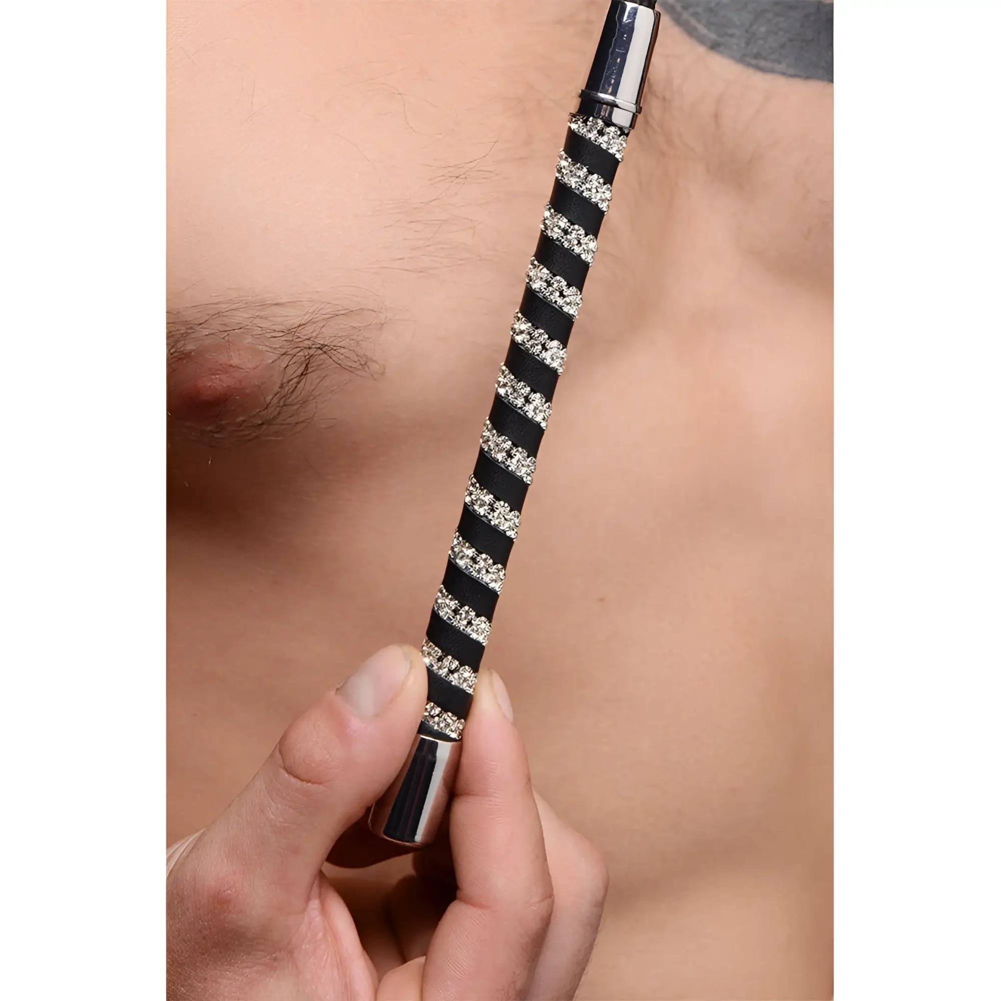 Short leather riding crop with black and silver stripes and rhinestone embellished handle
