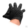 Shots Fist It black textured masturbation glove with finger nubs and an open, gathered wrist design on a hand.