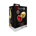Gold heart-shaped metal butt plug with ruby red gemstone center from ouch! shots ouch heart gem large gold ruby red