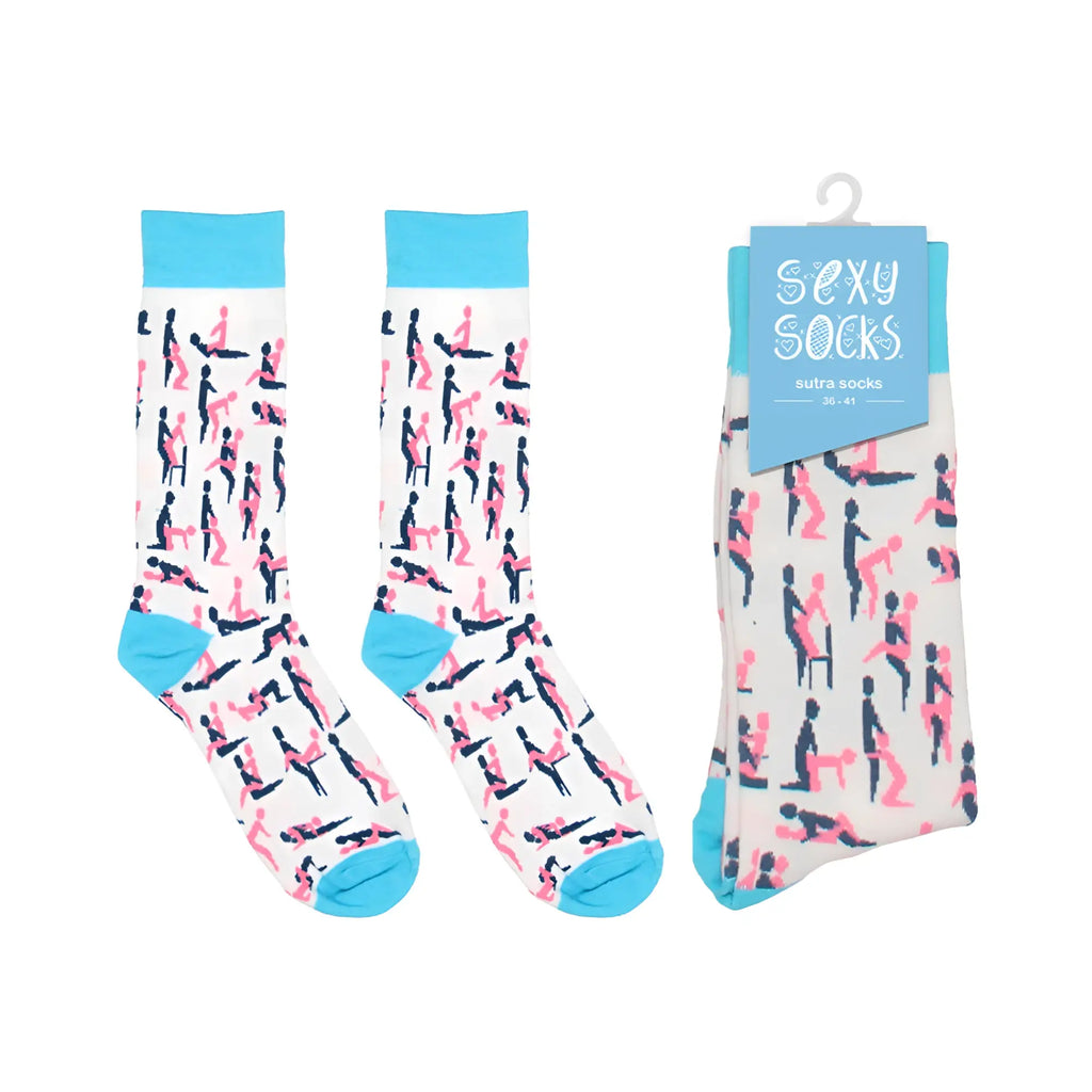 A pair of shots socks sutra socks s m white with pink and black playful silhouettes and bright blue cuffs and toes