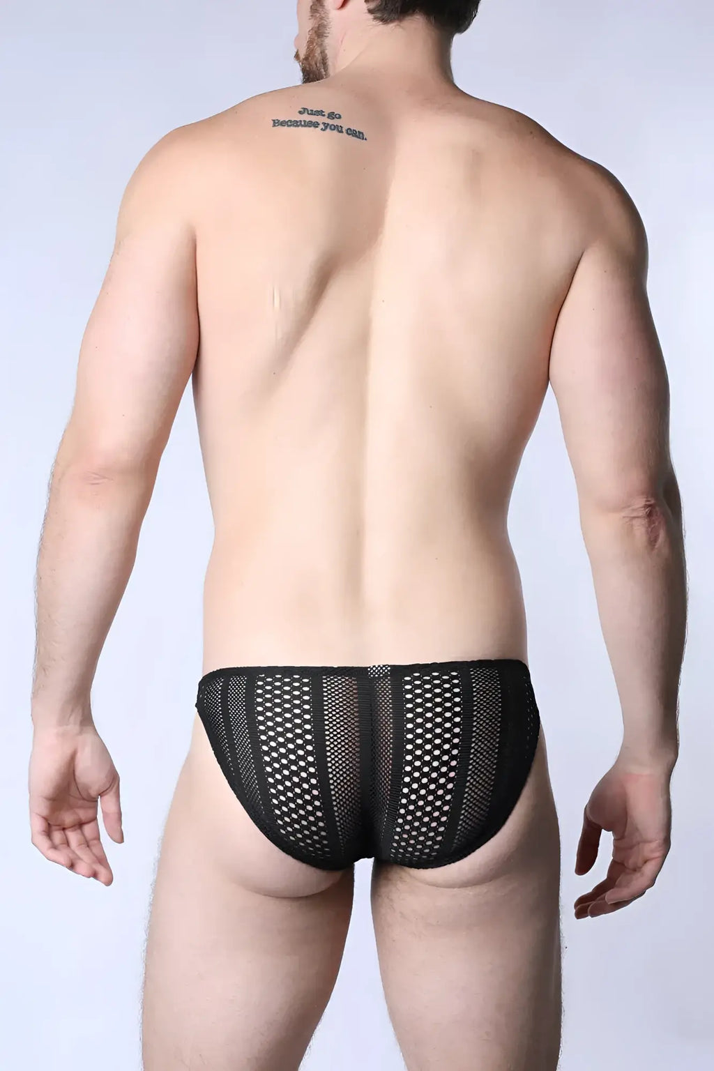 Black mesh sicily crochet low rise swim brief with small evenly spaced holes across the fabric