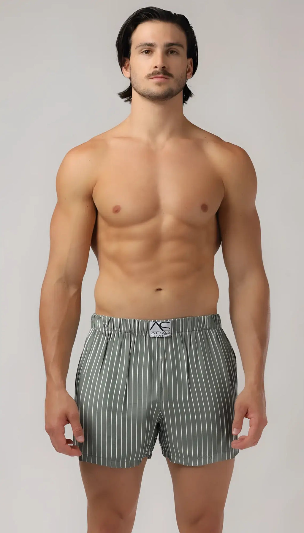 Men’s gray and white vertically striped side pocket relax boxers with branded elastic waistband for comfort and style