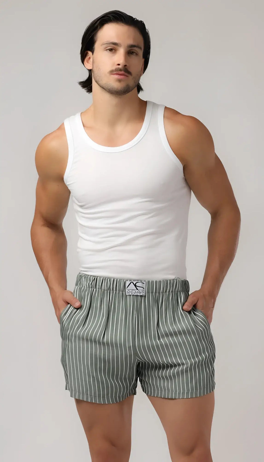 White cotton tank top with simple round neckline paired with side pocket relax boxers for casual comfort