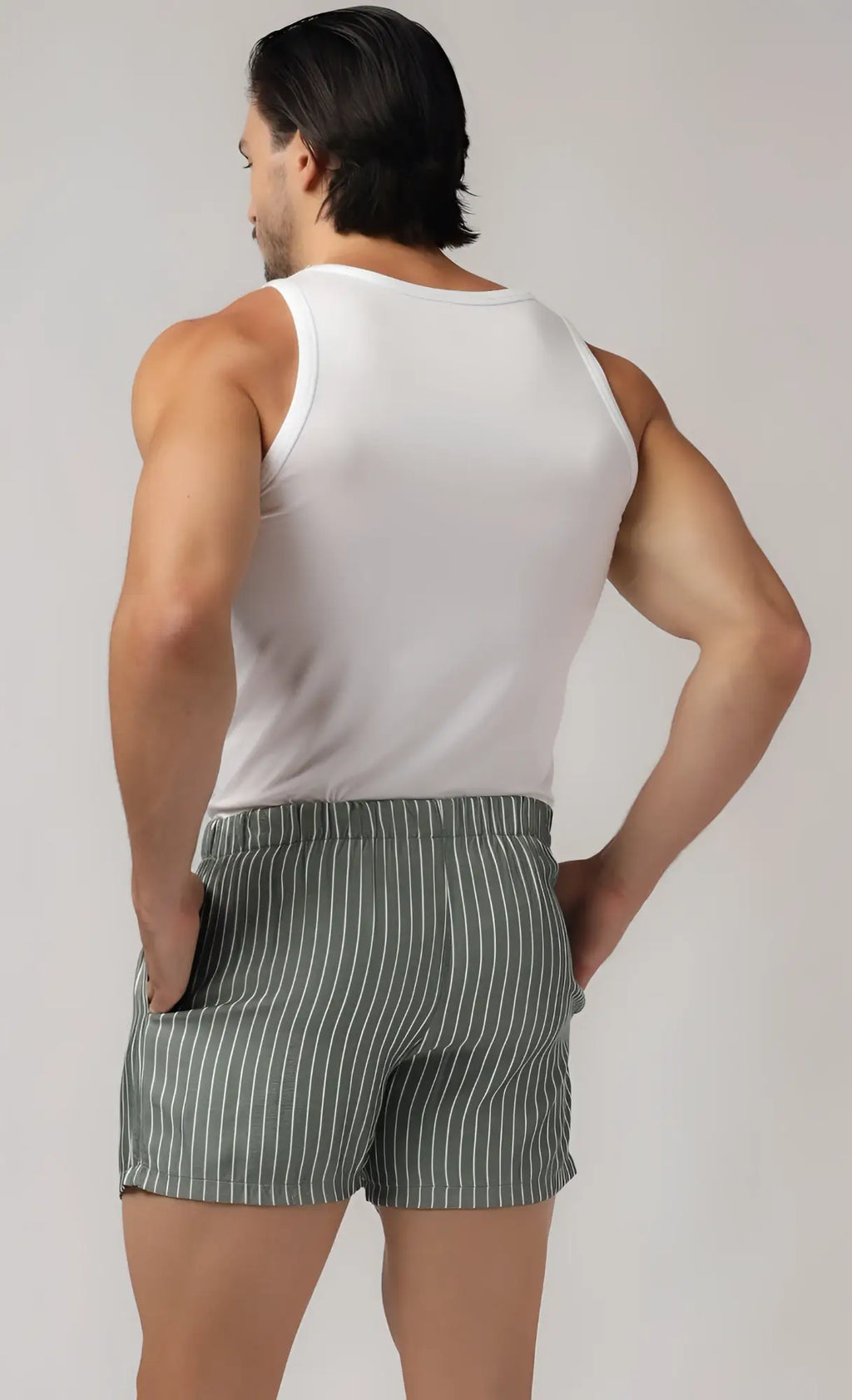 White sleeveless tank top paired with striped side pocket relax boxers for comfortable casual wear