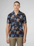 Black short-sleeved button-up shirt with signature botanical print featuring blue pink and orange orchid flowers