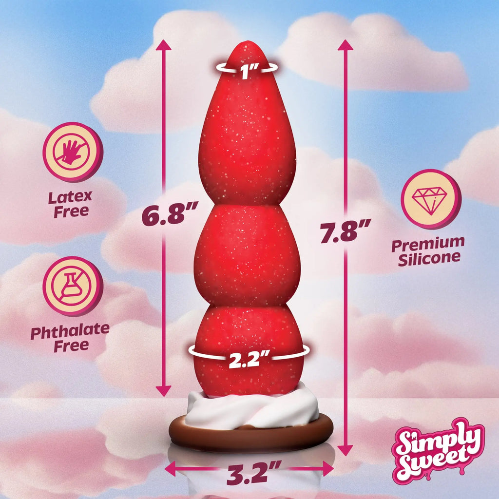 Simply Sweet Strawberry dildo: A red, textured silicone toy on a white cream and brown cookie base with measurements.