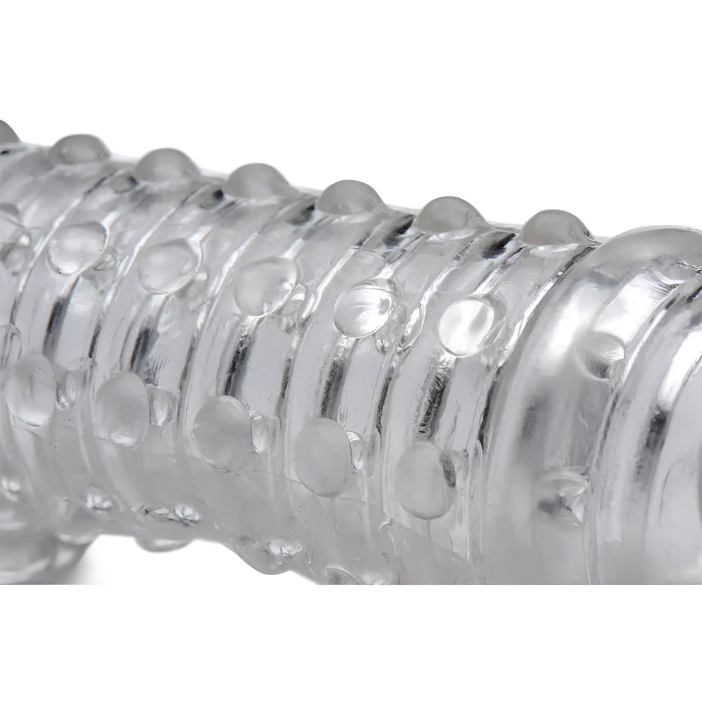 Clear Size Matters 1.5 Inch Penis Enhancer Sleeve featuring a ribbed, textured surface with raised bumps.