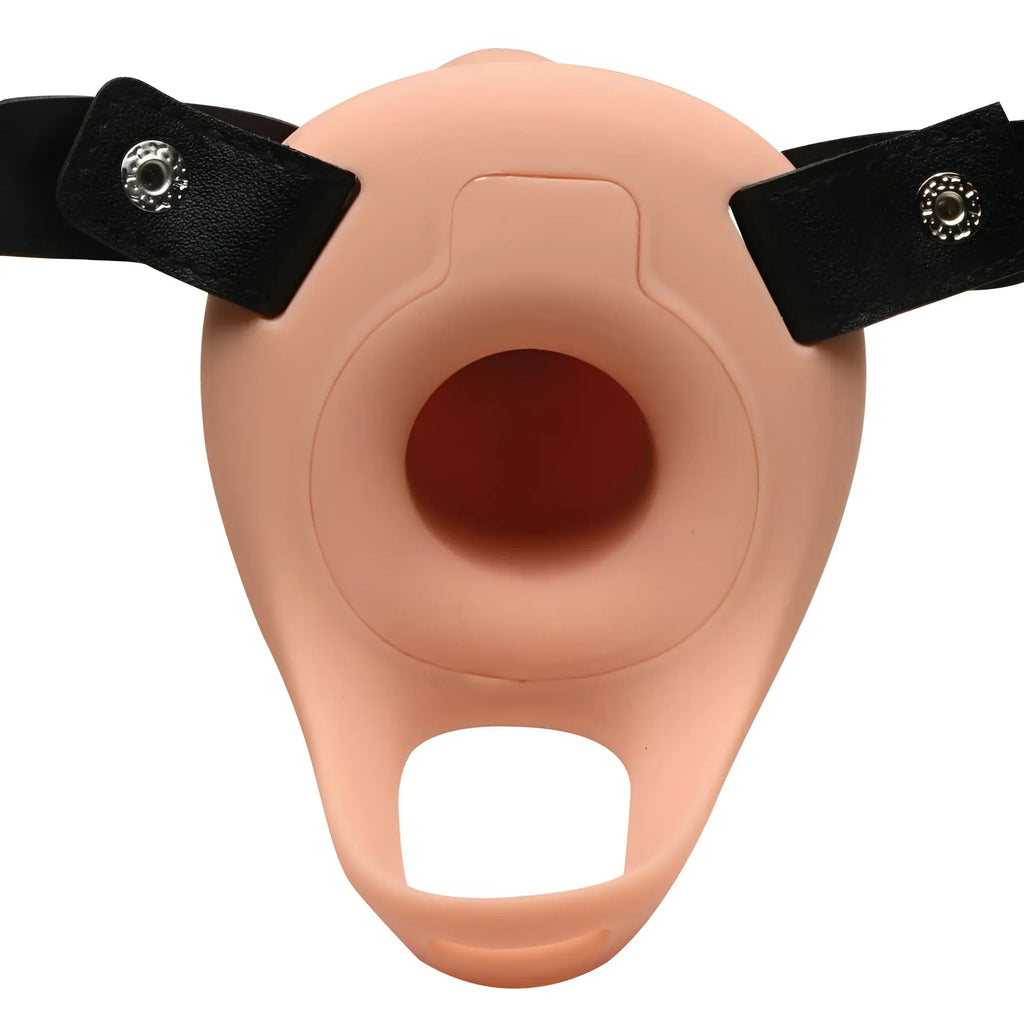 Size Matters 2 Inch silicone penis sheath in peach, featuring a central opening and black adjustable straps with snaps.