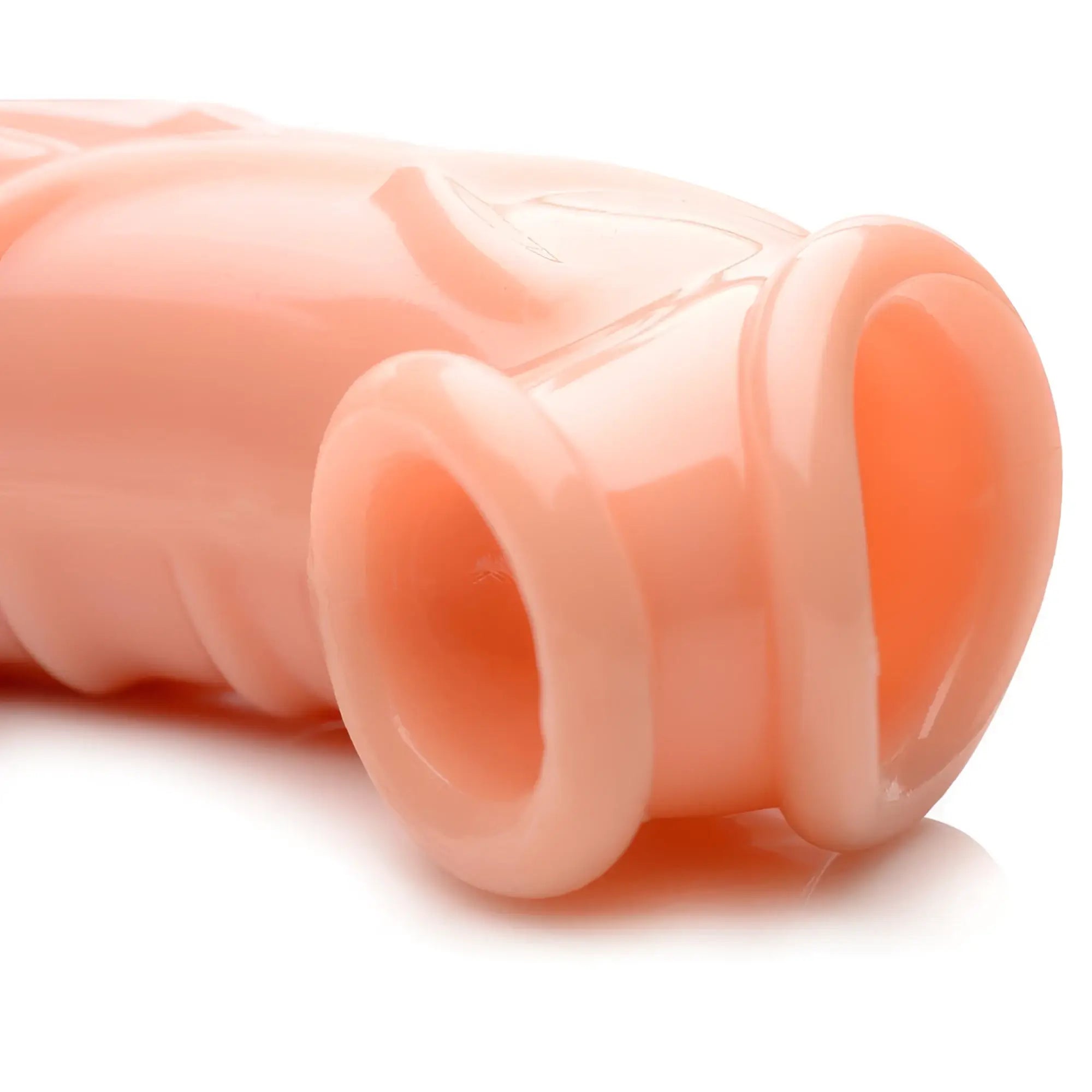 Close-up of the Size Matters 2 Inch Flesh Extender Sleeve, featuring a smooth, light-toned silicone texture.