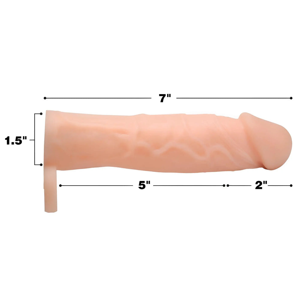 Size Matters 2-inch silicone penis extension, skin-toned, showing 7-inch total length with dimensional measurement lines.