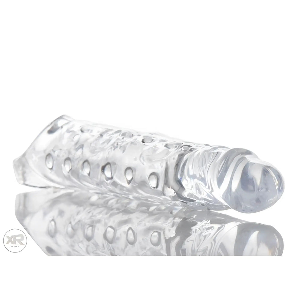 Size Matters 3-Inch Clear Extender Sleeve with a textured, transparent design, shown against a reflective white surface.