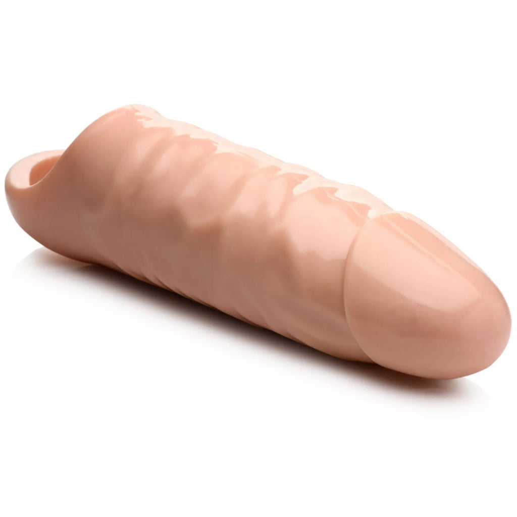Size Matters 7-inch penis extension: a realistic, flesh-toned silicone sleeve with a textured, phallic design.
